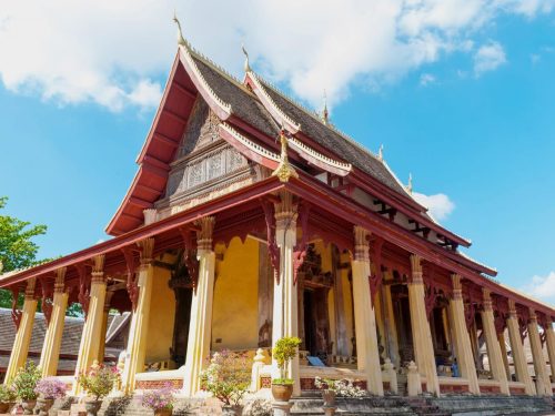 Wat Xieng Thong Temple with traditional multi-tiered roof in Luang Prabang – iconic stop on the Luang Prabang 4‑Day Tour