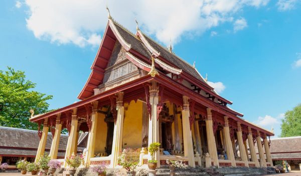 Wat Xieng Thong Temple with traditional multi-tiered roof in Luang Prabang – iconic stop on the Luang Prabang 4‑Day Tour