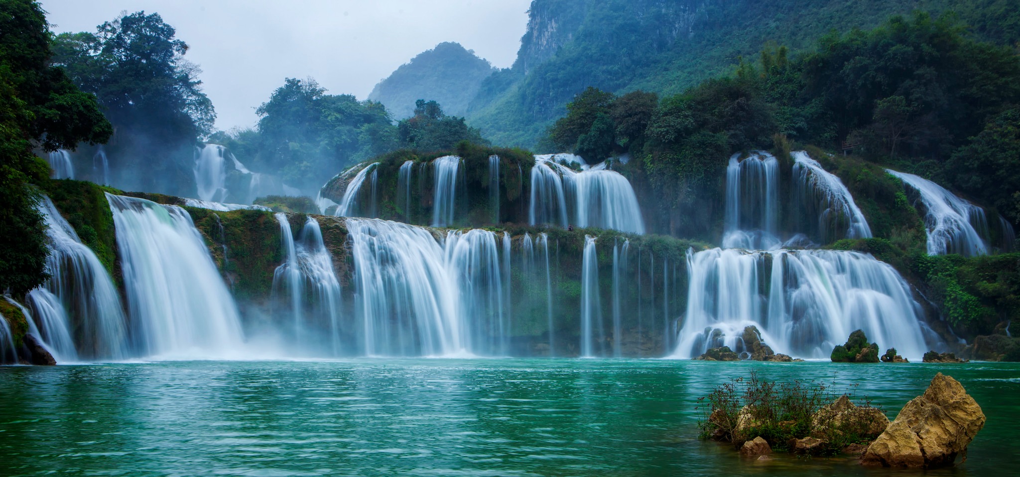 Visitors on a Ban Gioc Waterfall tour exploring the scenic beauty of Cao Bang in northern Vietnam