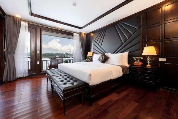 Elegant double room on La Regina Legend Cruise with premium bedding, large window, and sophisticated decor in Lan Ha Bay