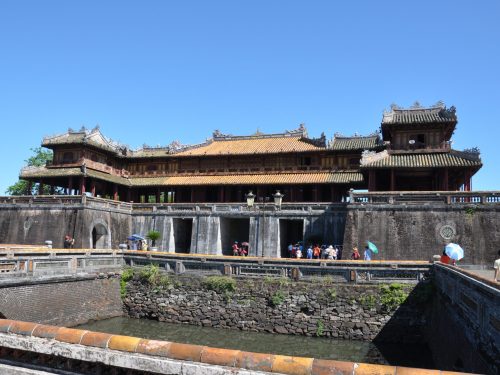 Visitors exploring Hue Imperial City on a Hue Imperial City Tour Full Day from Da Nang, enjoying ancient architecture