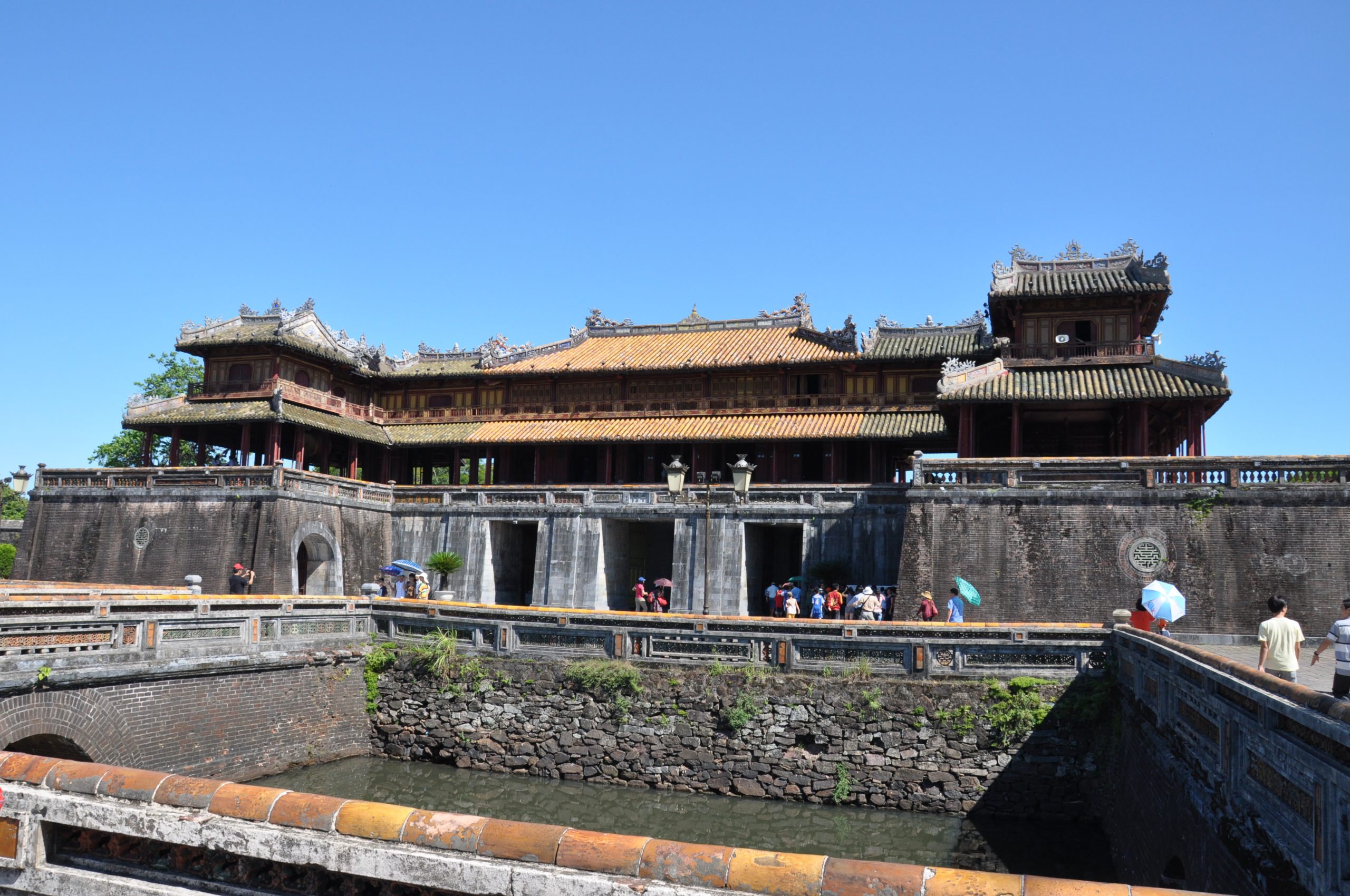 Visitors exploring Hue Imperial City on a Hue Imperial City Tour Full Day from Da Nang, enjoying ancient architecture