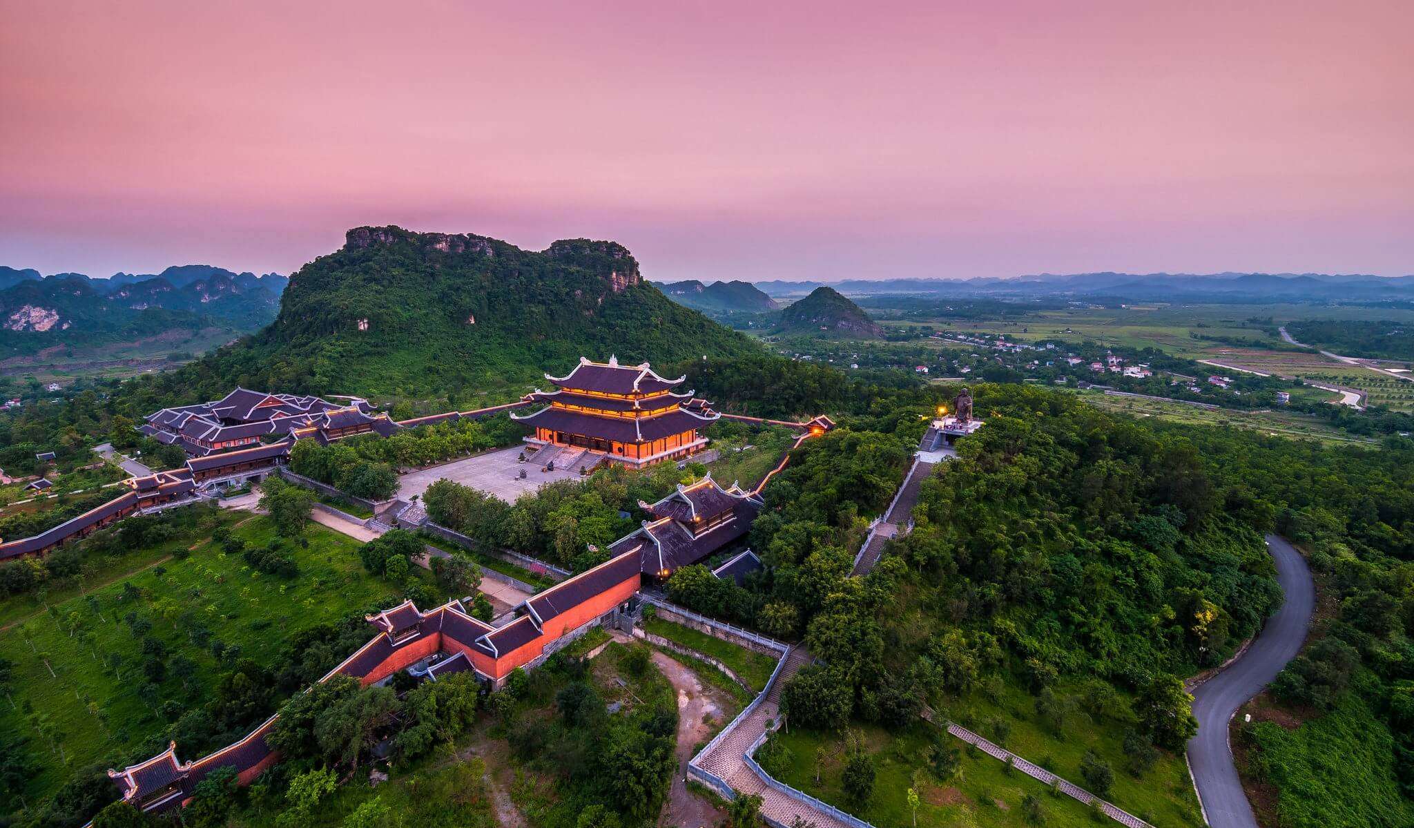 Visitors exploring Bai Dinh Pagoda complex during a Ninh Binh Day Tour from Hanoi
