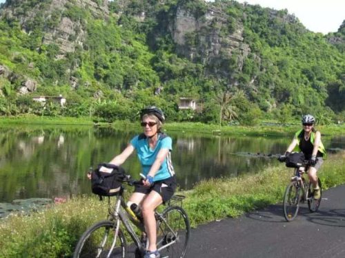 Biking through local villages and rice paddies in Ninh Binh during a day trip