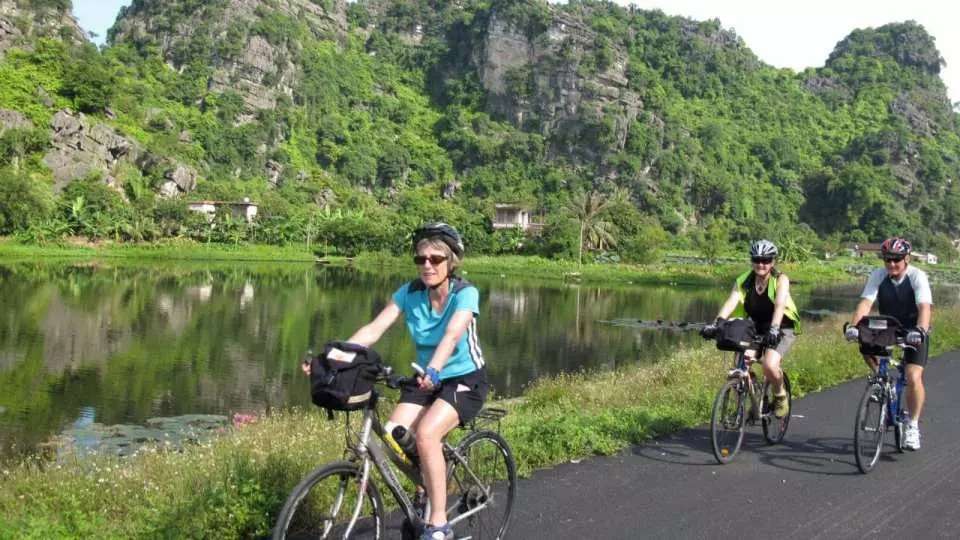 Biking through local villages and rice paddies in Ninh Binh during a day trip