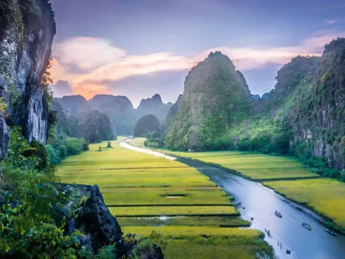 Discover the natural wonders of Tam Coc, often called the ‘Halong Bay on land’ for its breathtaking landscape