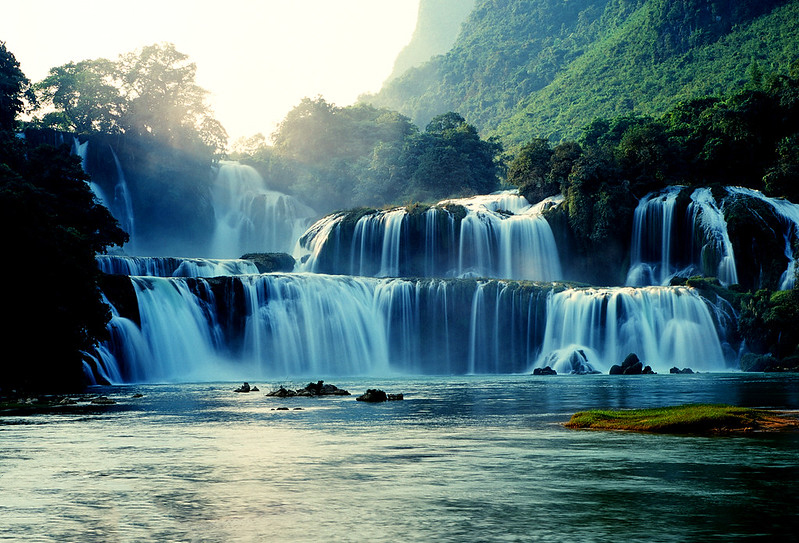 Stunning view of Ban Gioc Waterfall cascading down limestone cliffs