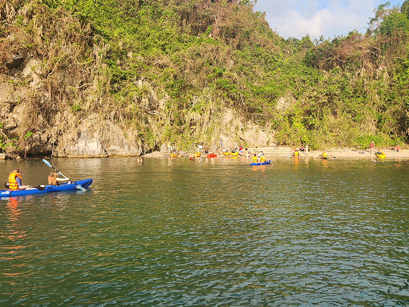 Cap La Island in Bai Tu Long Bay with calm waters and lush green hills