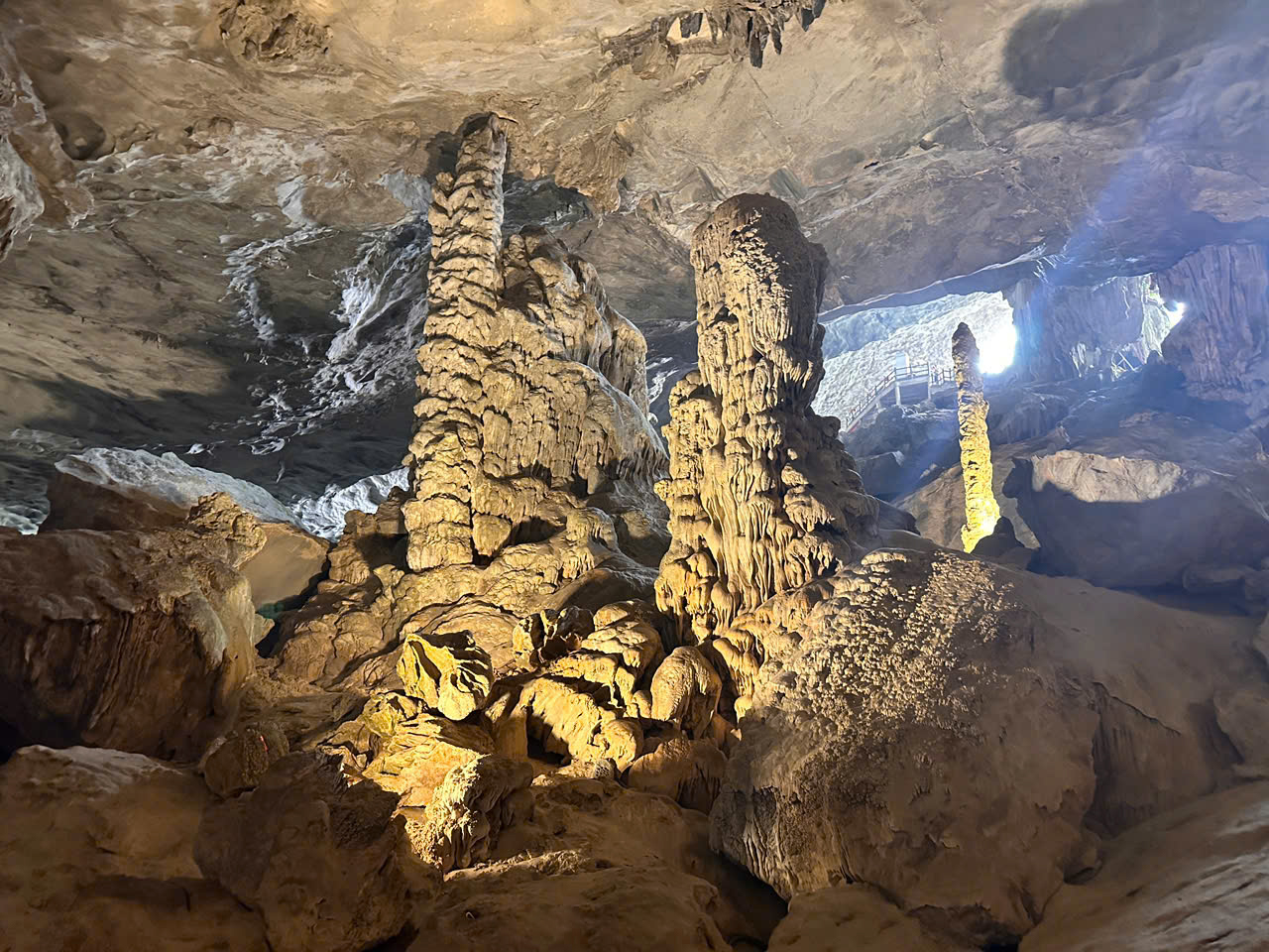 Inside Sung Sot Cave on a Halong Bay day trip, featuring stunning rock formations and wide, awe-inspiring chambers