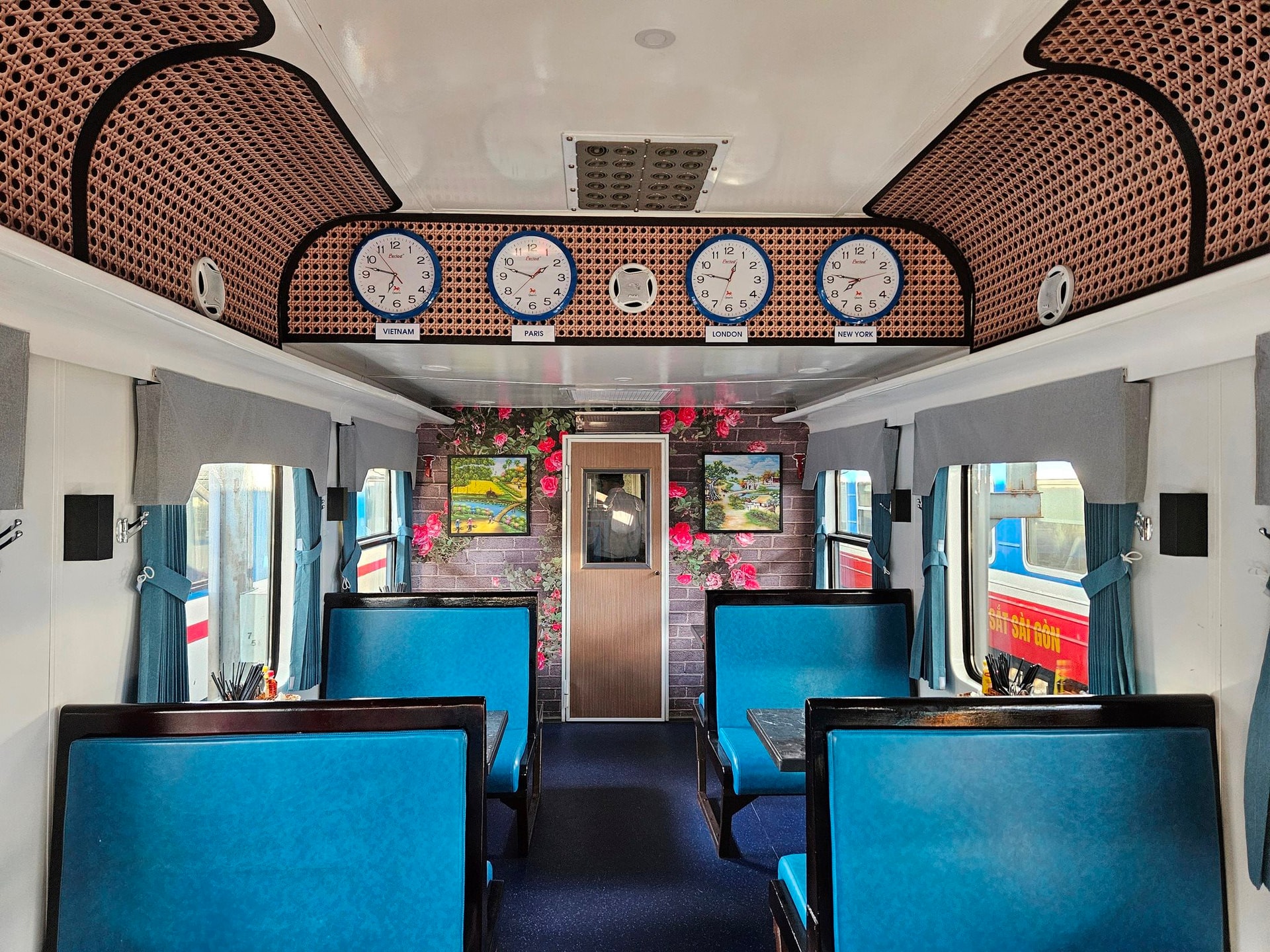Dining cabin of the Vietnam 5-star luxury train with elegant seating and world time clocks