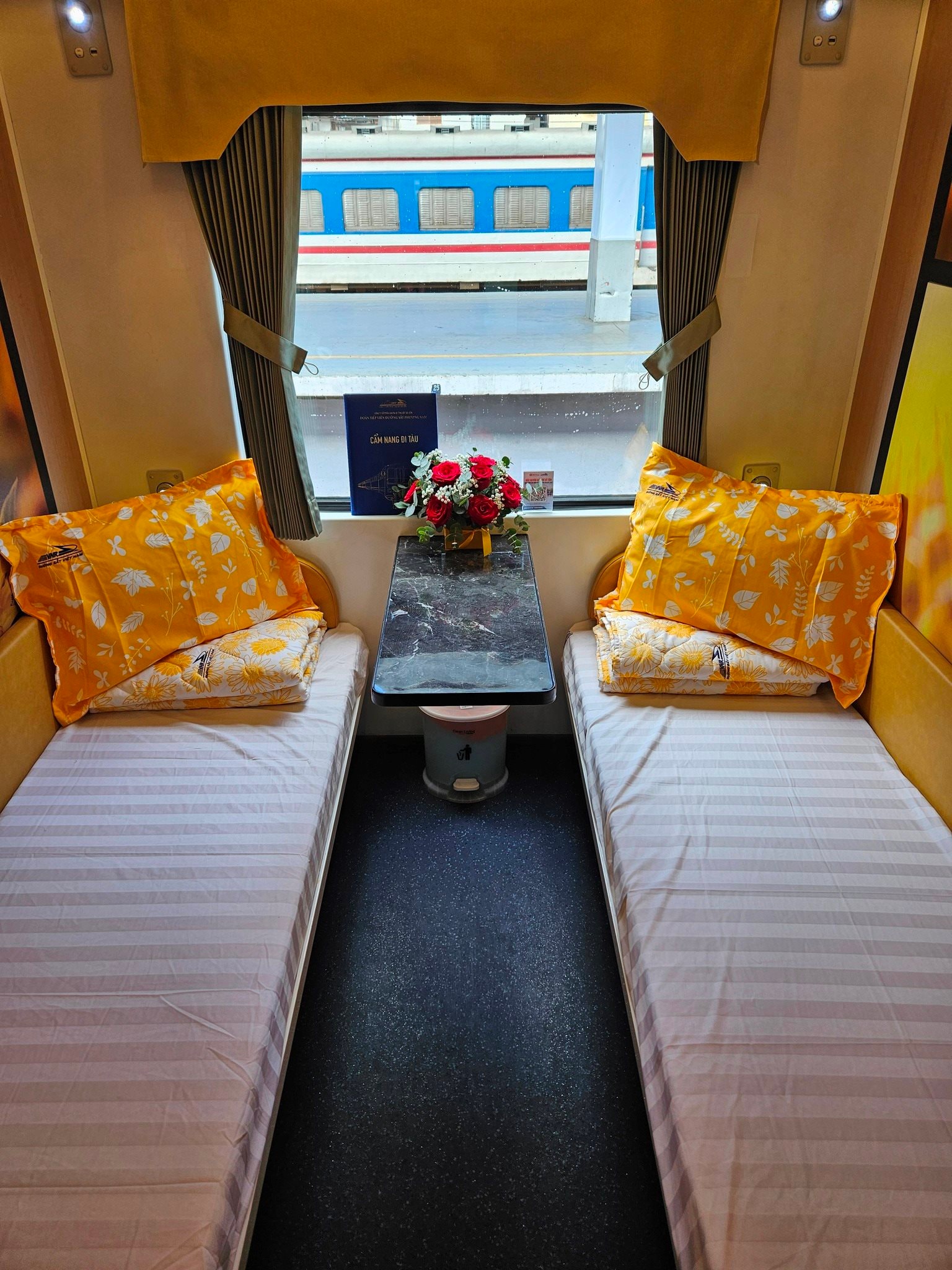 Cozy sleeping cabin with twin beds on the Vietnam 5-star luxury train