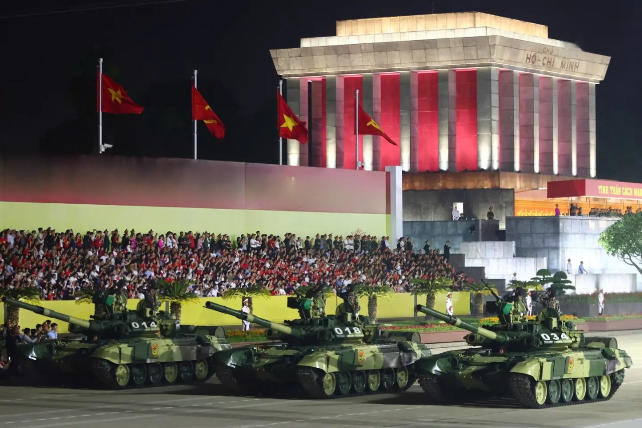 Spectators watch military tanks at Ho Chi Minh Mausoleum during Vietnam National Day 80 Years parade